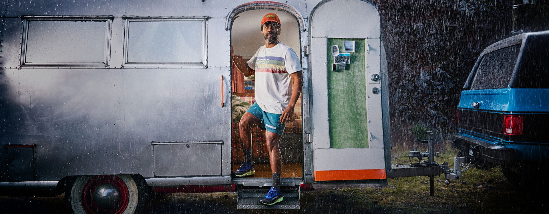 Person coming out of a trailer into the rain